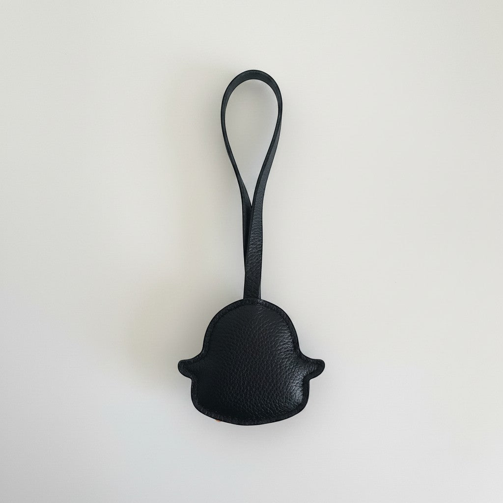 Penguroo® Gifts Inc. black faux leather penguin charm accessory with loop for bags and backpacks.