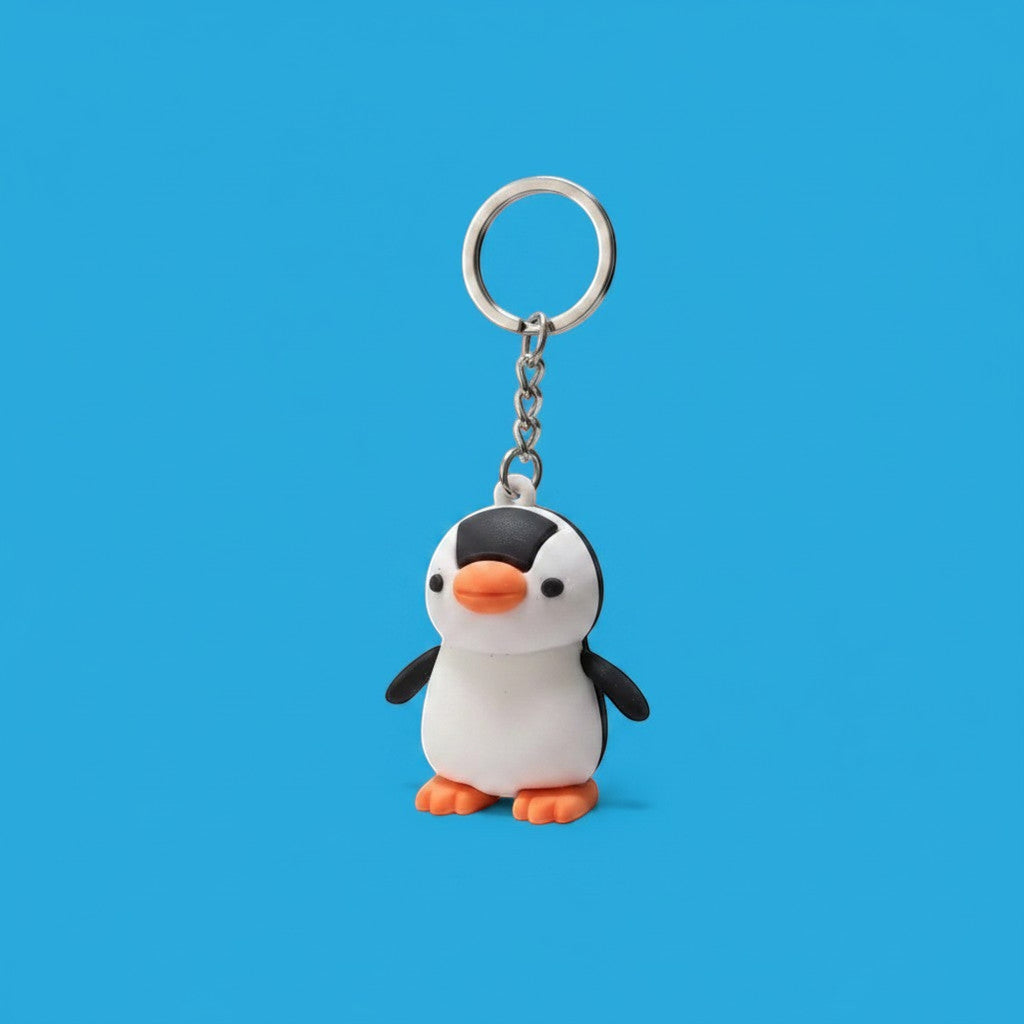 Penguroo® Gifts Inc. black and white penguin charm keychain with orange feet and beak.