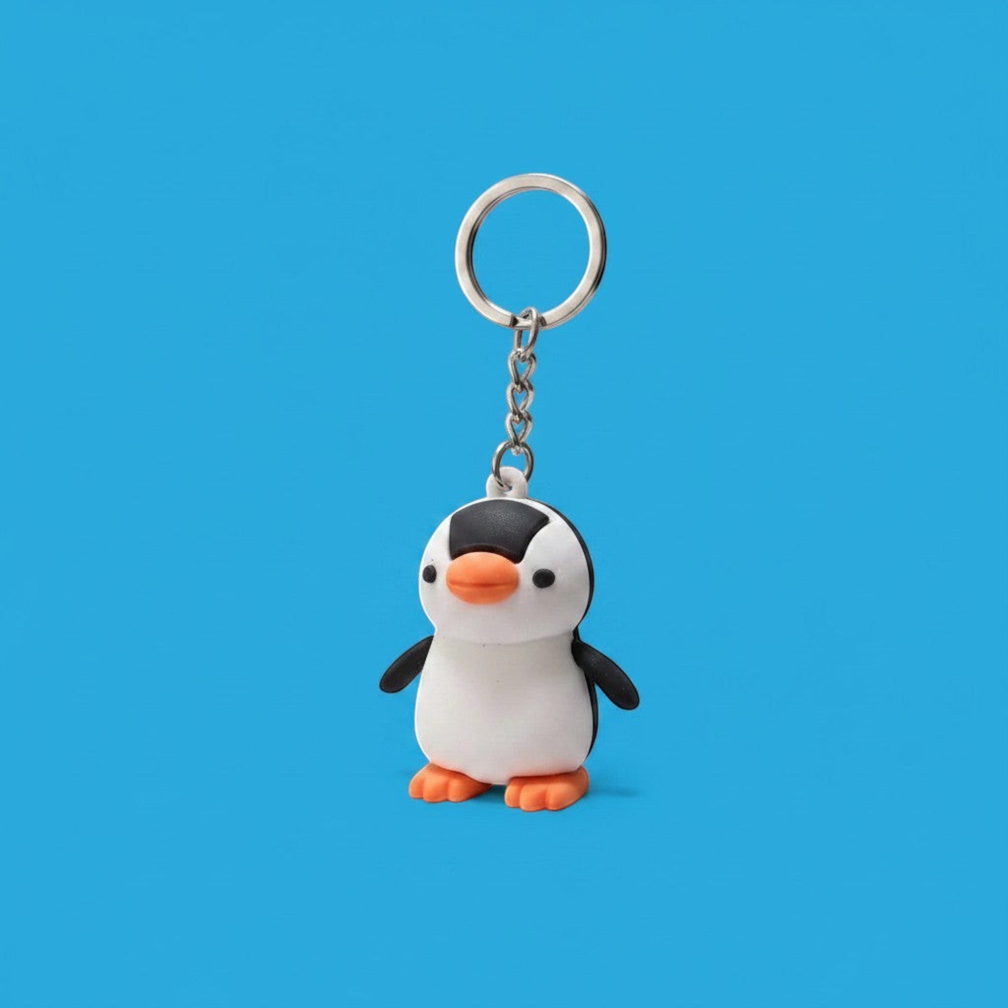 Penguroo® Gifts Inc. black and white penguin charm keychain with orange feet and beak.